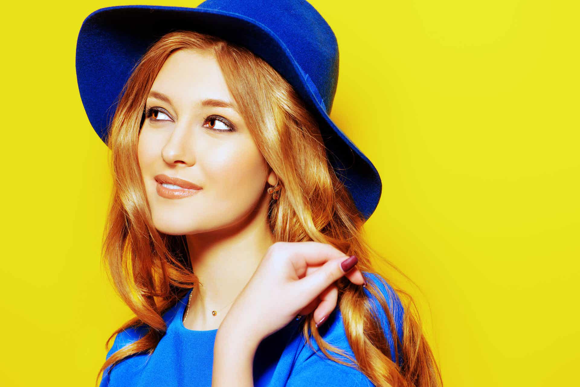 A woman with a subtle smile, looking off to the side.