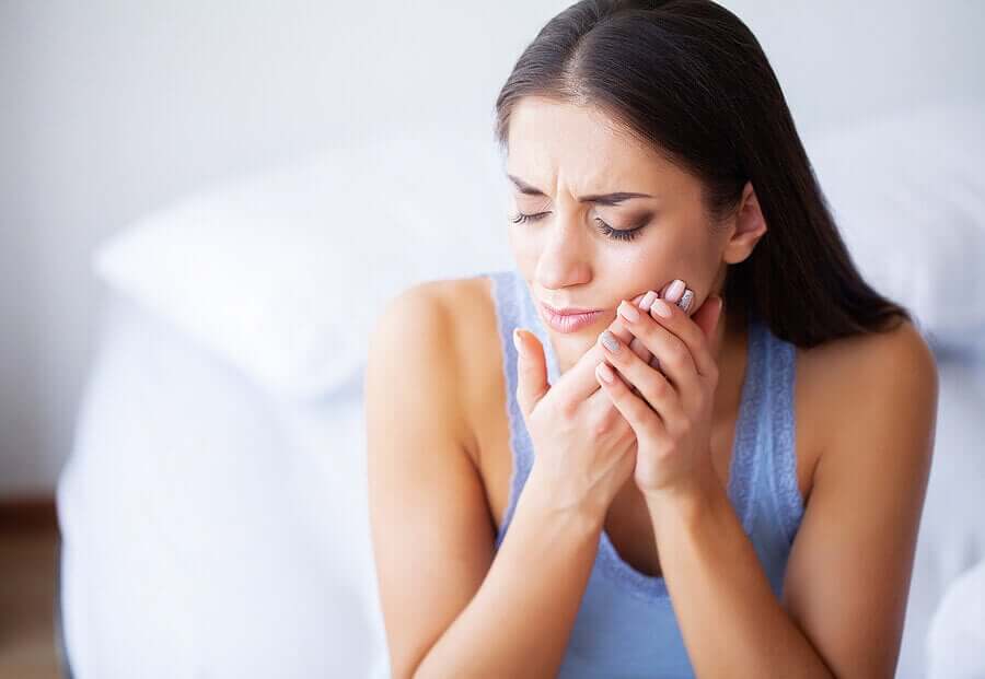A woman with jaw pain.