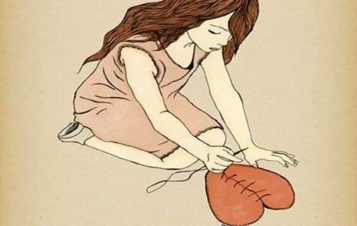 woman sewing a heart