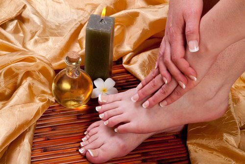 Woman treating her calluses with castor oil and apple cider vinegar