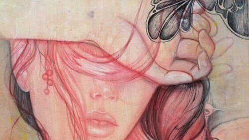 A woman covering her eyes.