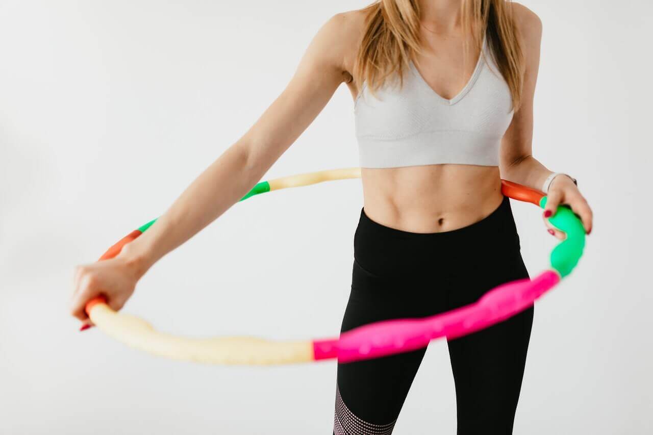 A woman using a hula hoop.