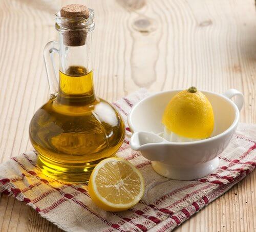 Juicing a lemon with olive oil