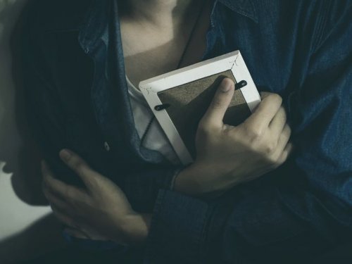 Person holding a picture frame