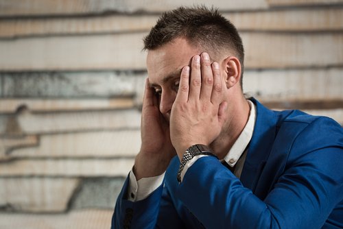 A man with a migraine.