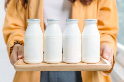 A woman holding dairy products.