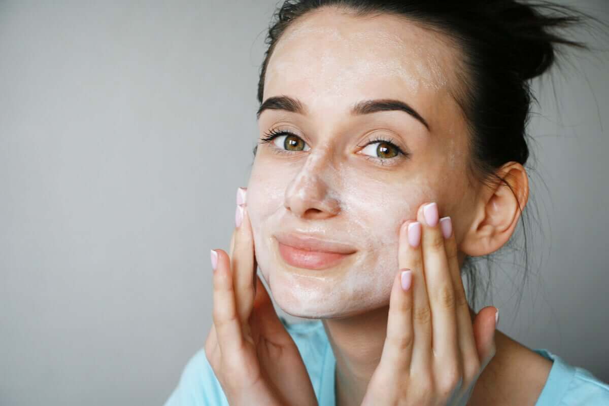 A woman washing her face.