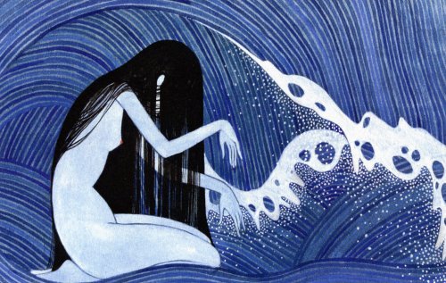 A naked woman in some waves.
