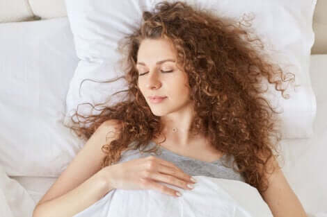 A woman sleeping in bed.
