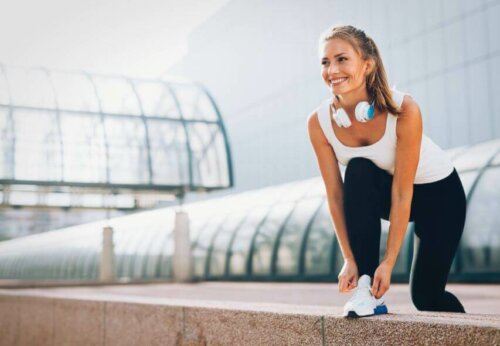 A jogger fixing her shoe.