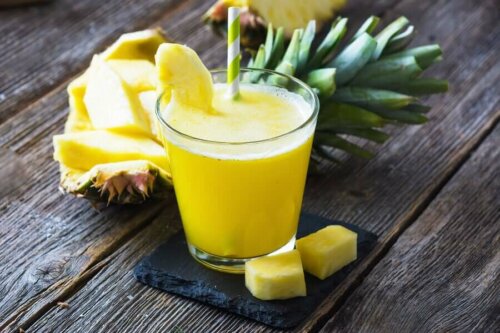 A pineapple natural fat-burning smoothie on a table.