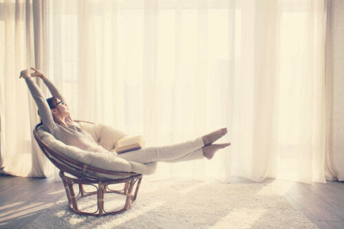 A woman relaxing on a chair.