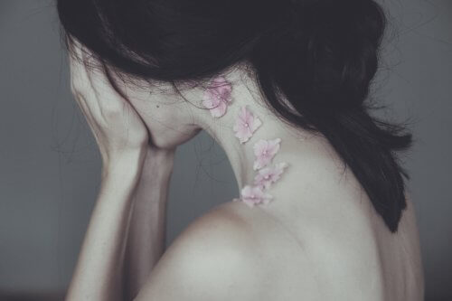 Sad girl covering her face