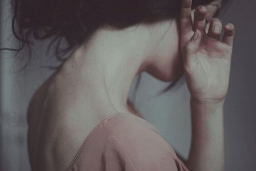 A woman suffering because someone she loves is ignoring her.