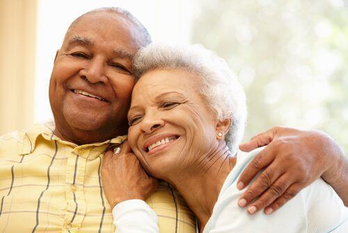 Older couple smiling and hugging