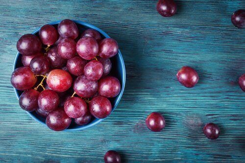 Bowl of red grapes use two for vitamin c exfoliant