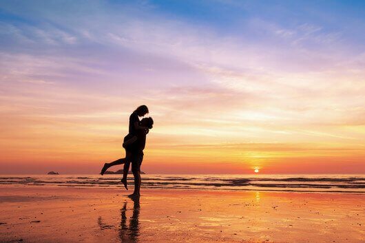Couple in love dancing on a beach because age is just a number