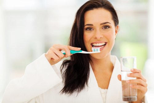 Woman brushing her teeth