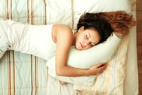 Woman sleeping with clean white pillow