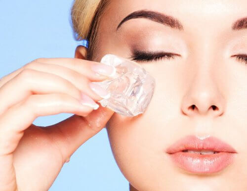 Woman applying ice therapy