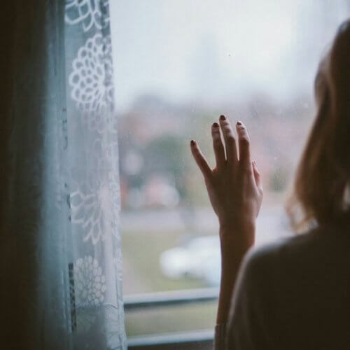 A woman looking out the window.