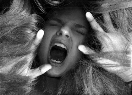 A woman screaming.