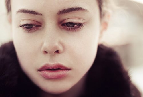 A woman who is suffering emotionally.