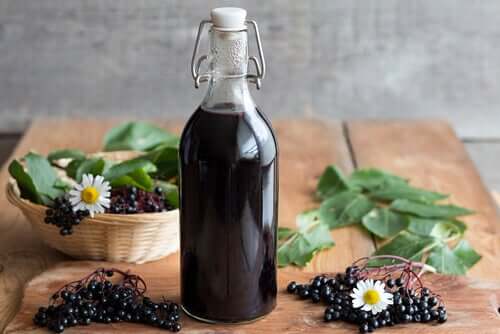 A bottle of blackberry syrup on a table.