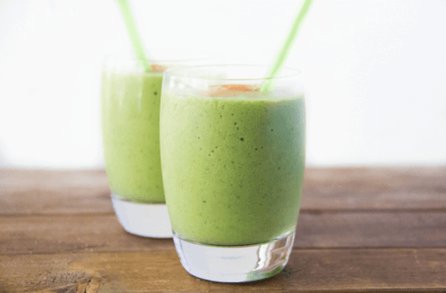 Avocado smoothies on a table.