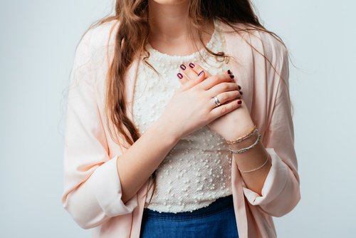 Woman touching her heart
