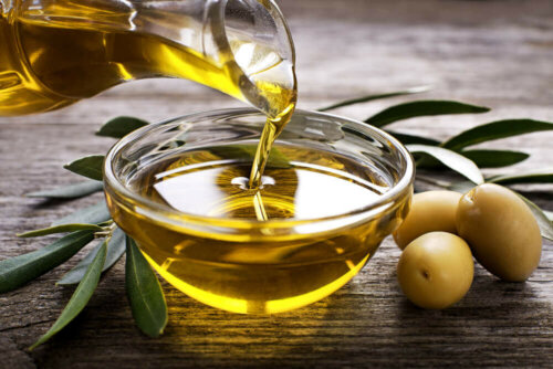 Olive oil being poured into a bowl.