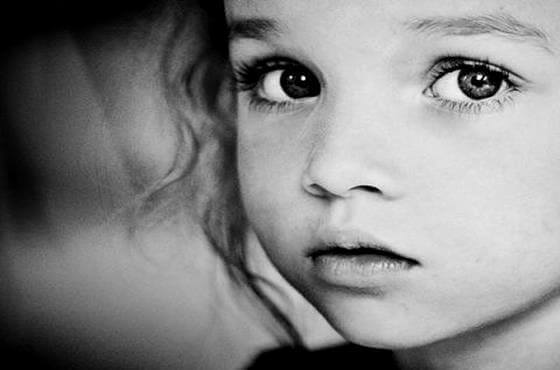 A sad girl looking into the camera