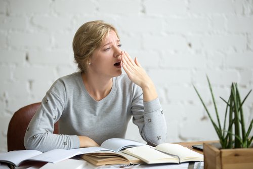 Exhausted woman yawns cant concentrate need to detox
