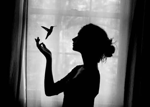 A woman with a bird.