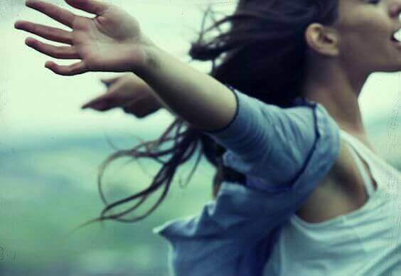 A woman in the wind simbolizing the feeling of freedom when no one treats you badly.