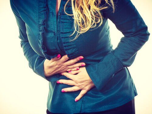 A woman with a pain in her stomach.