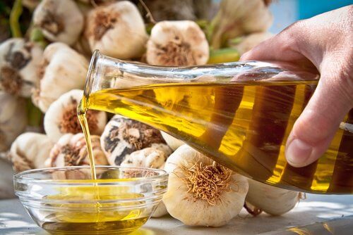 Person pouring out olive oil