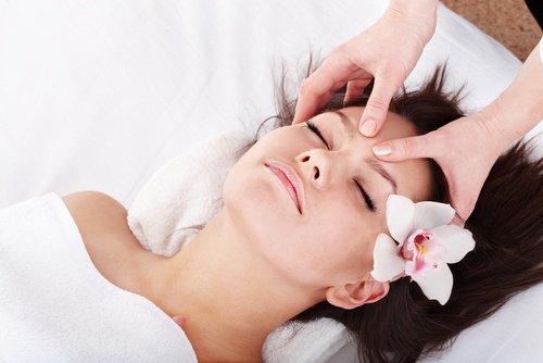 Woman getting facial massage