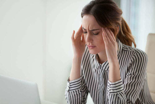 A woman with a headache.