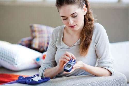 A woman checking her blood sugar.