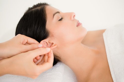 Woman getting an ear massage