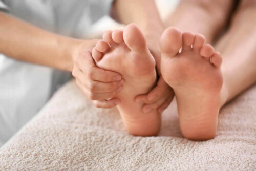 A person trying to relieve bunion pain.