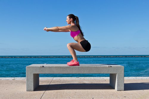 This woman is going to tone her glutes at the beach.