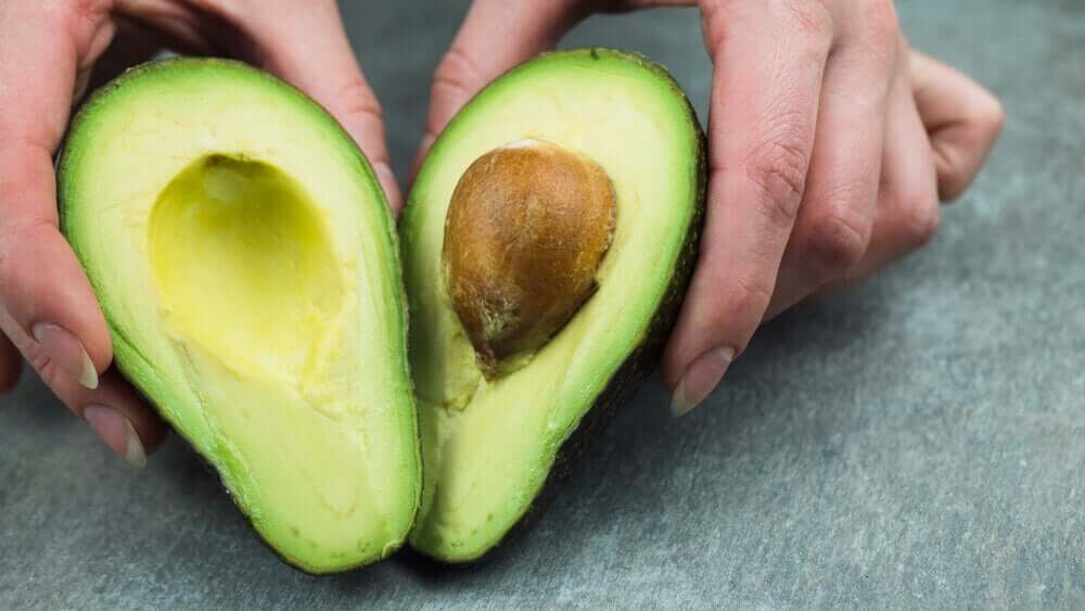 An avocado cut in half.