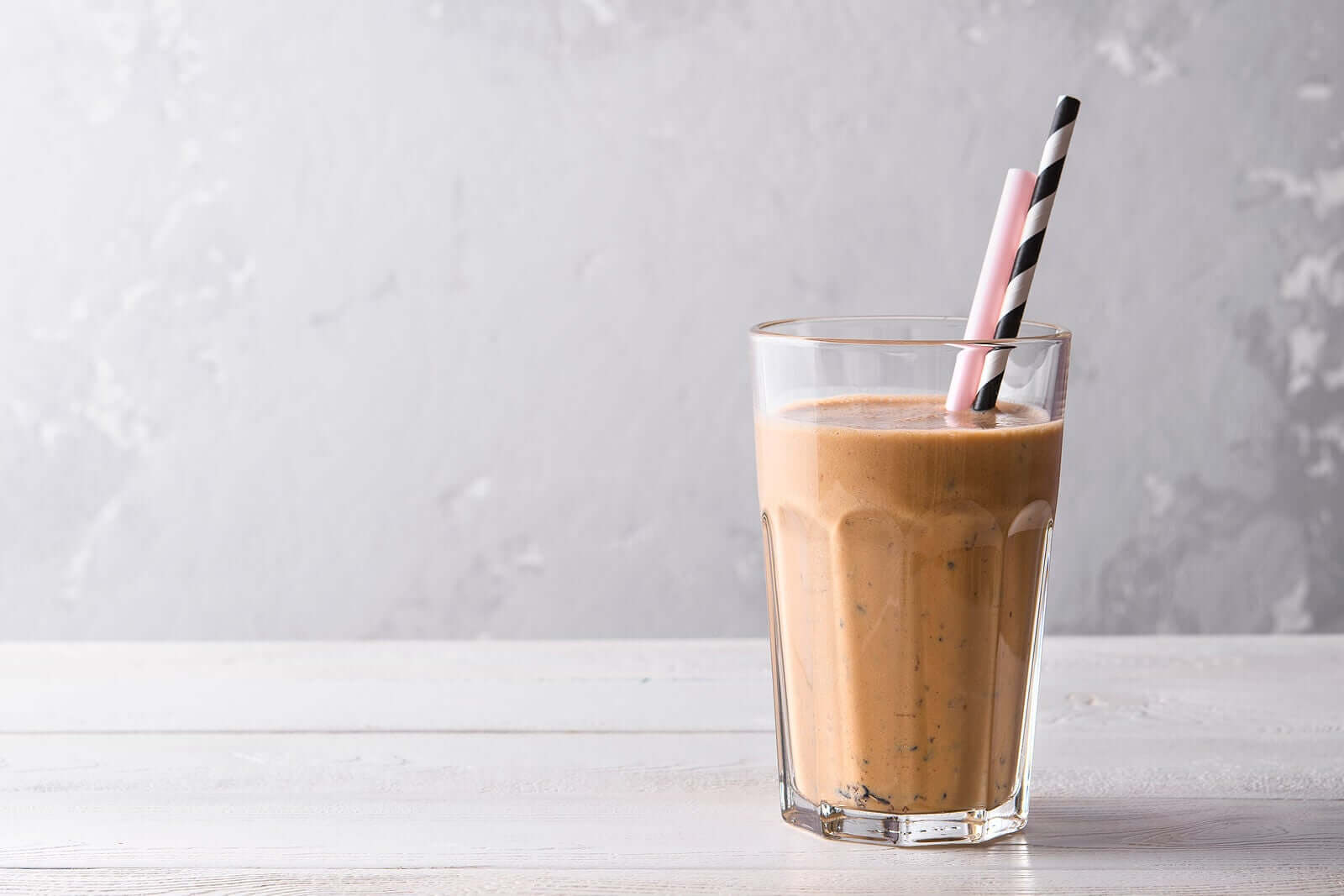 A glass of chocolate milk.