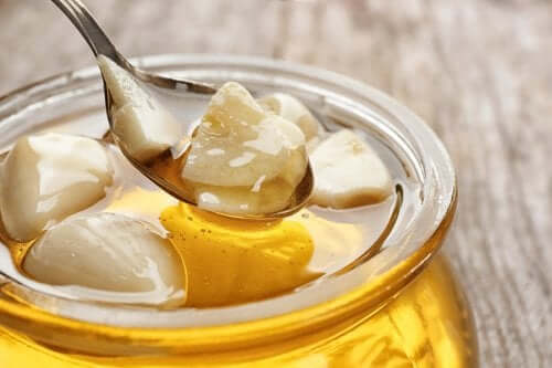 A jar of honey and garlic gloves.