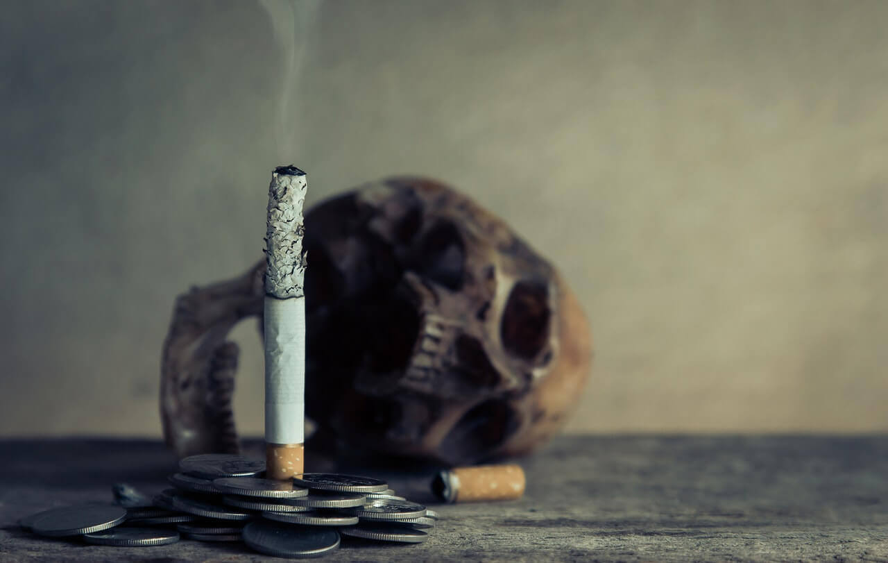 A burnt cigarette and a skull.