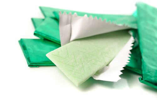 Avoiding some types of chewing gum is one of the flat stomach habits