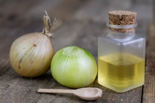 Some onions and onion juice on a table.