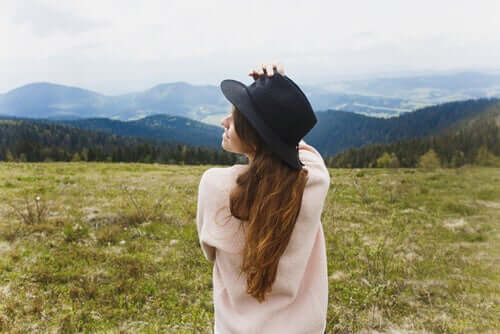 A woman sitting in a field.